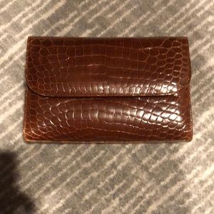 Brown leather clutch.